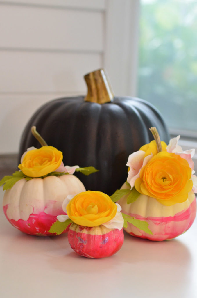Marbleized Floral Pumpkins by Happy Family Blog  Our Marbleized Floral Pumpkins are a great project for all skill levels. These use nail polish and flowers to add pops of color to your fall decor.